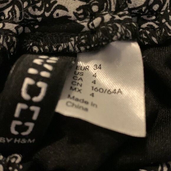 H&m black sugar skull hi low skirt. Elastic waist size four. NWOT. - Picture 7 of 10